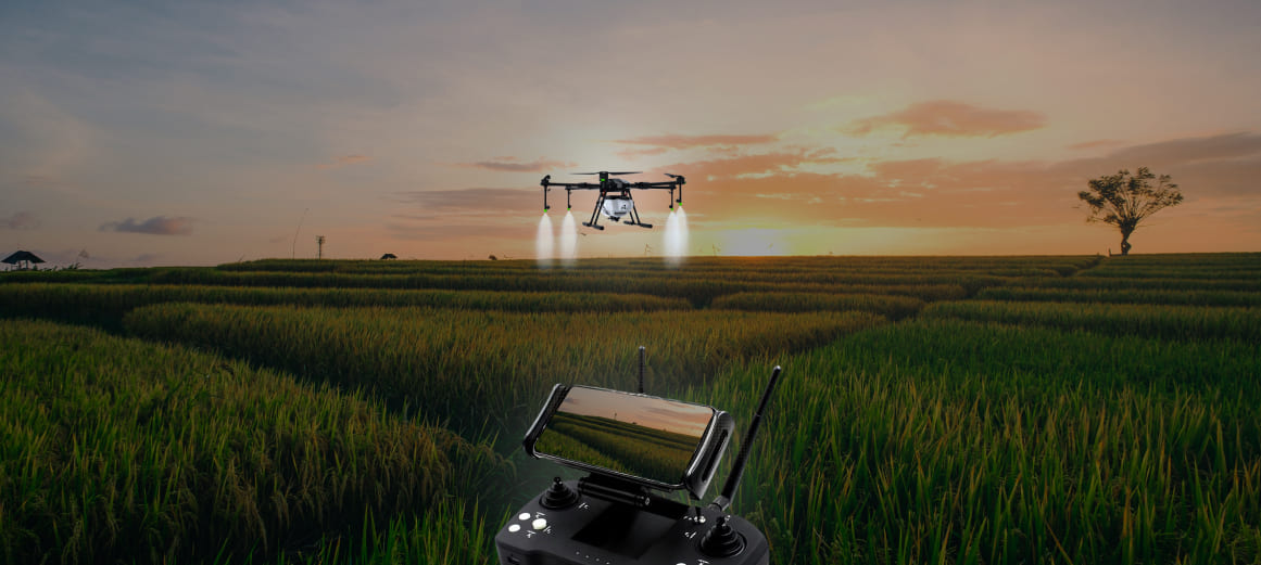 image of kisaan drone spraying chemicals.